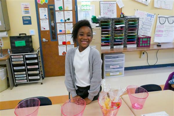 girl smiling with pink vases